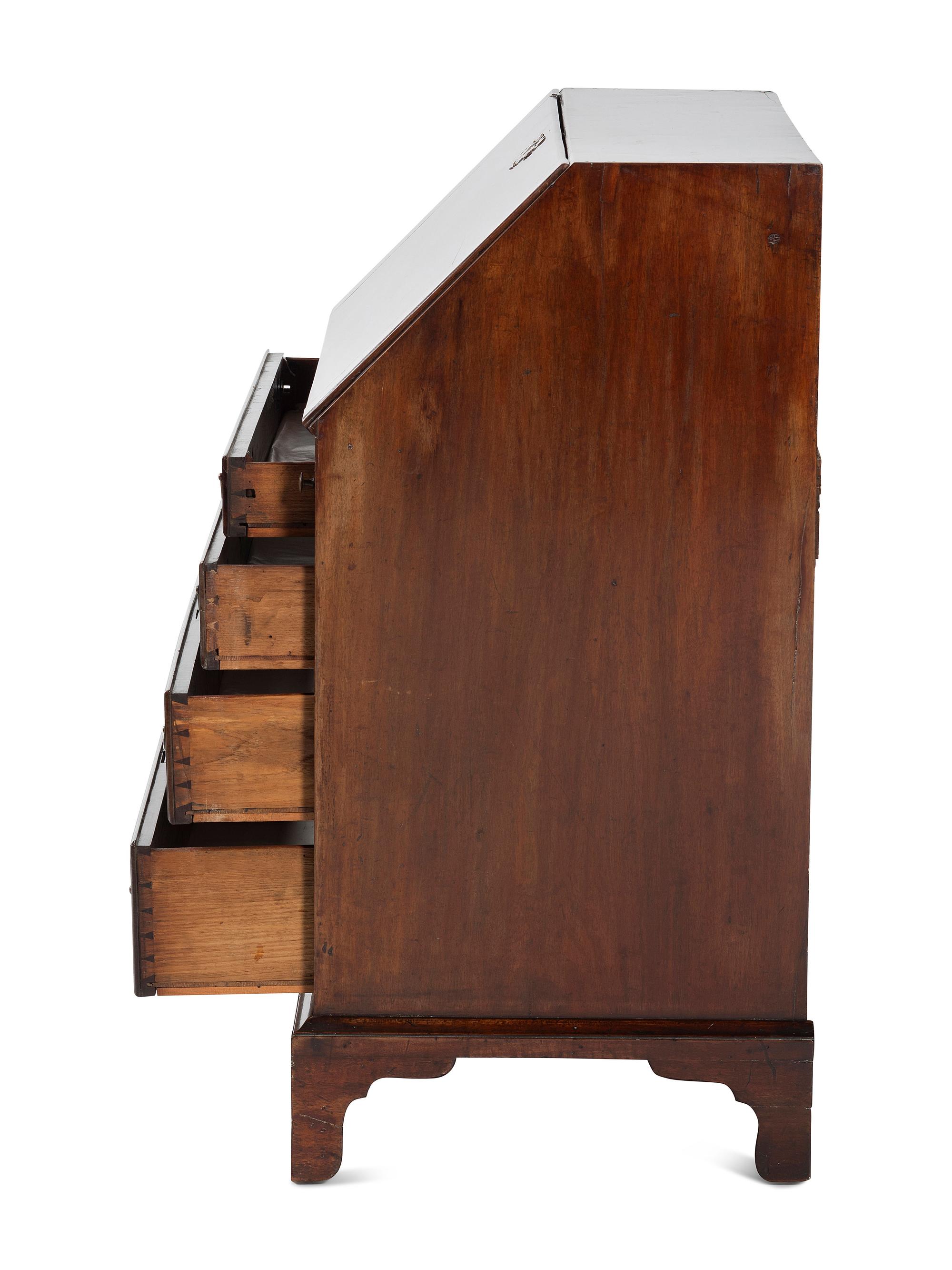 A Chippendale Figured and Shell-Carved Mahogany Slant Front Desk