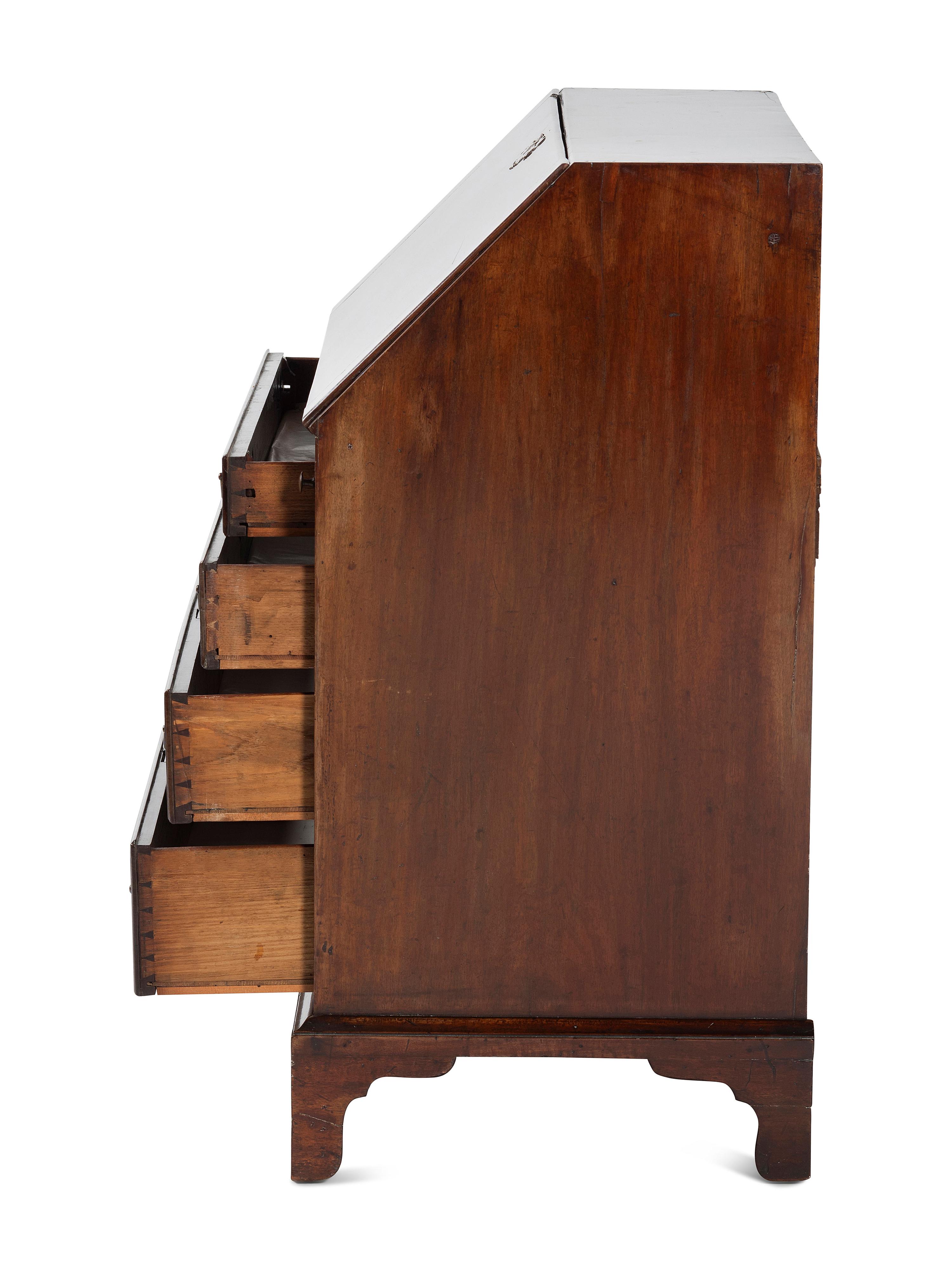 A Chippendale Figured and Shell-Carved Mahogany Slant Front Desk