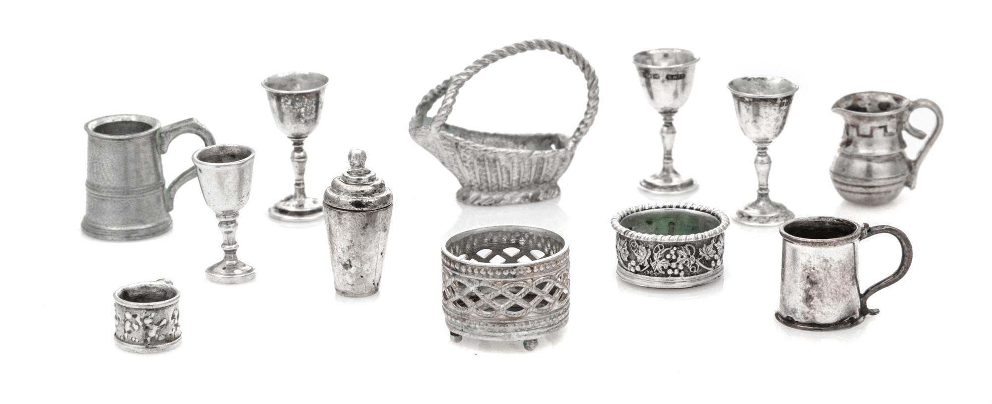 A Group of Silver Table Articles, Various Makers, comprising two wine coasters, three wine goblets, two tankards, a wine bottle cradle,