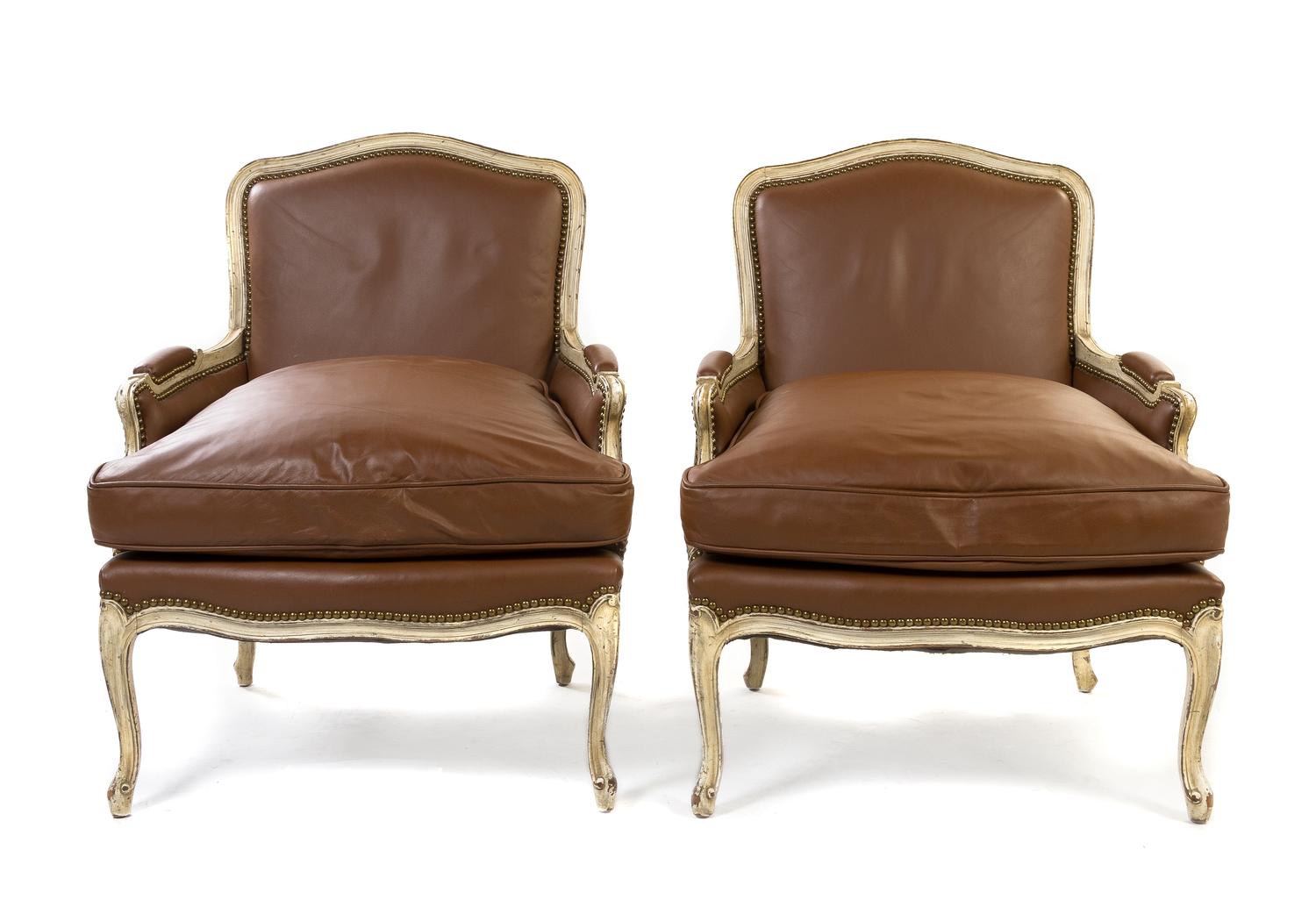 A Pair of Louis XV Style Painted and Channel Molded Bergeres, Height 34 3/4 inches.