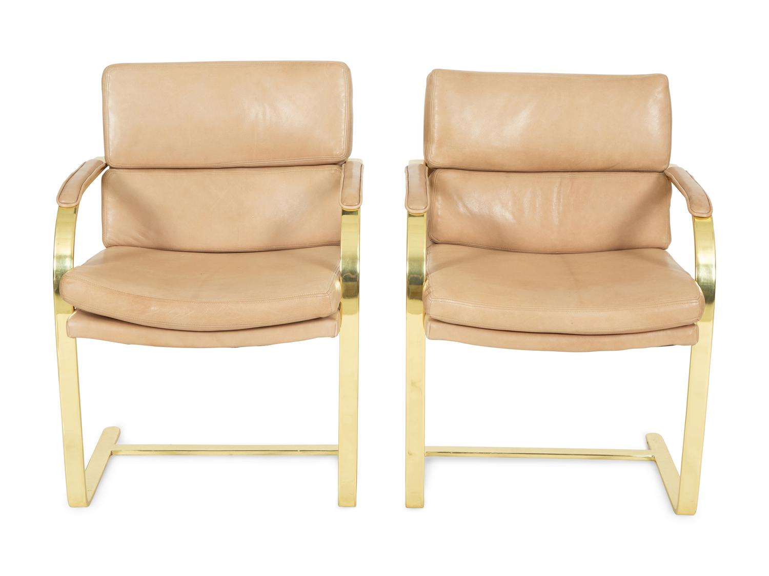 A Set of Twelve Gilt Steel Dining Chairs with Leather Upholstery