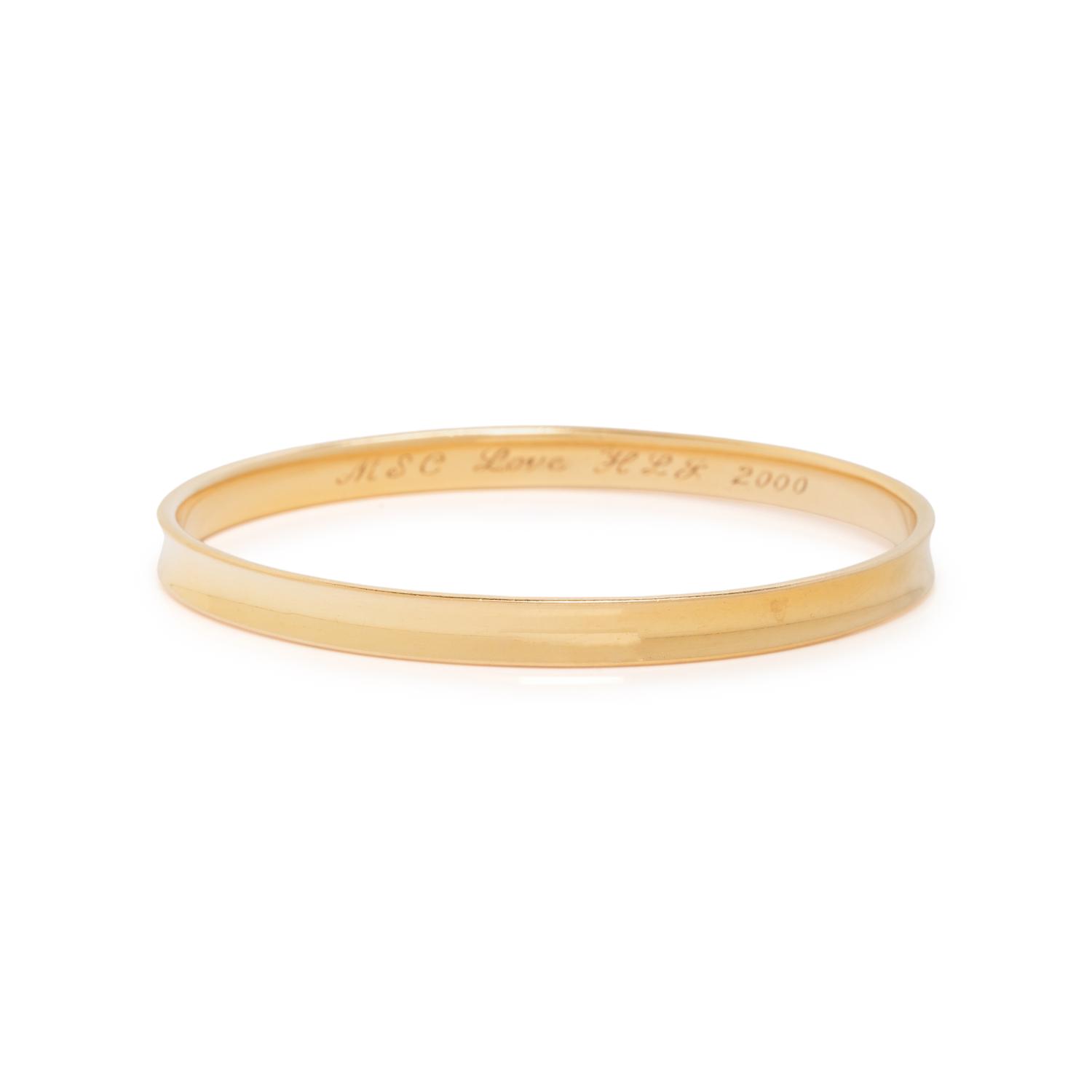 TIFFANY & CO., YELLOW GOLD ANNIVERSARY BANGLE BRACELET