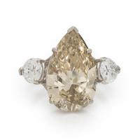 NATURAL FANCY BROWNISH YELLOW PEAR SHAPED DIAMOND AND DIAMOND RING