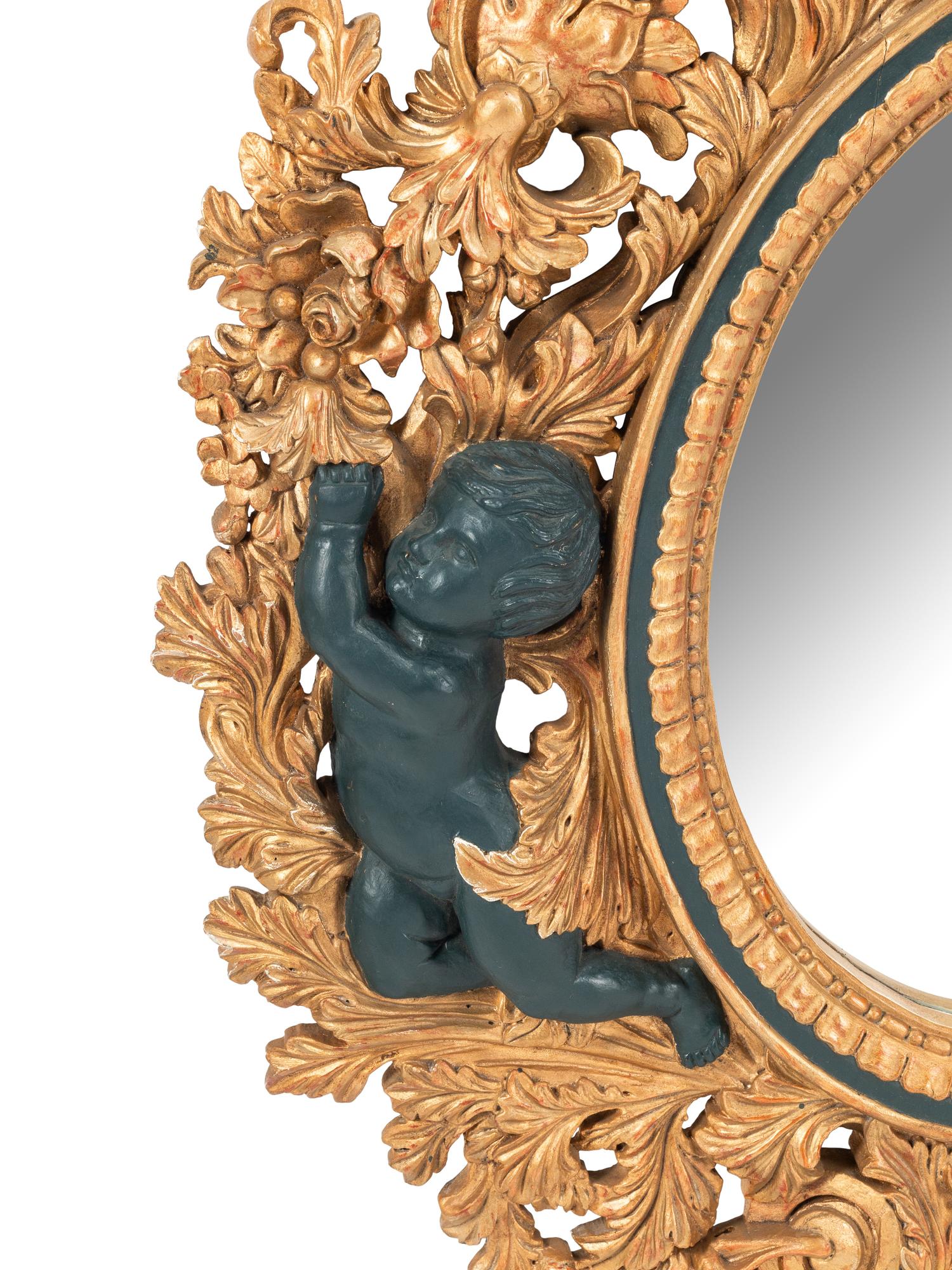 An Italian Baroque Style Gilt Mirror with Ebonized Cherubs