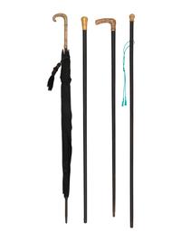 Four Gold Plated Handled Walking Sticks