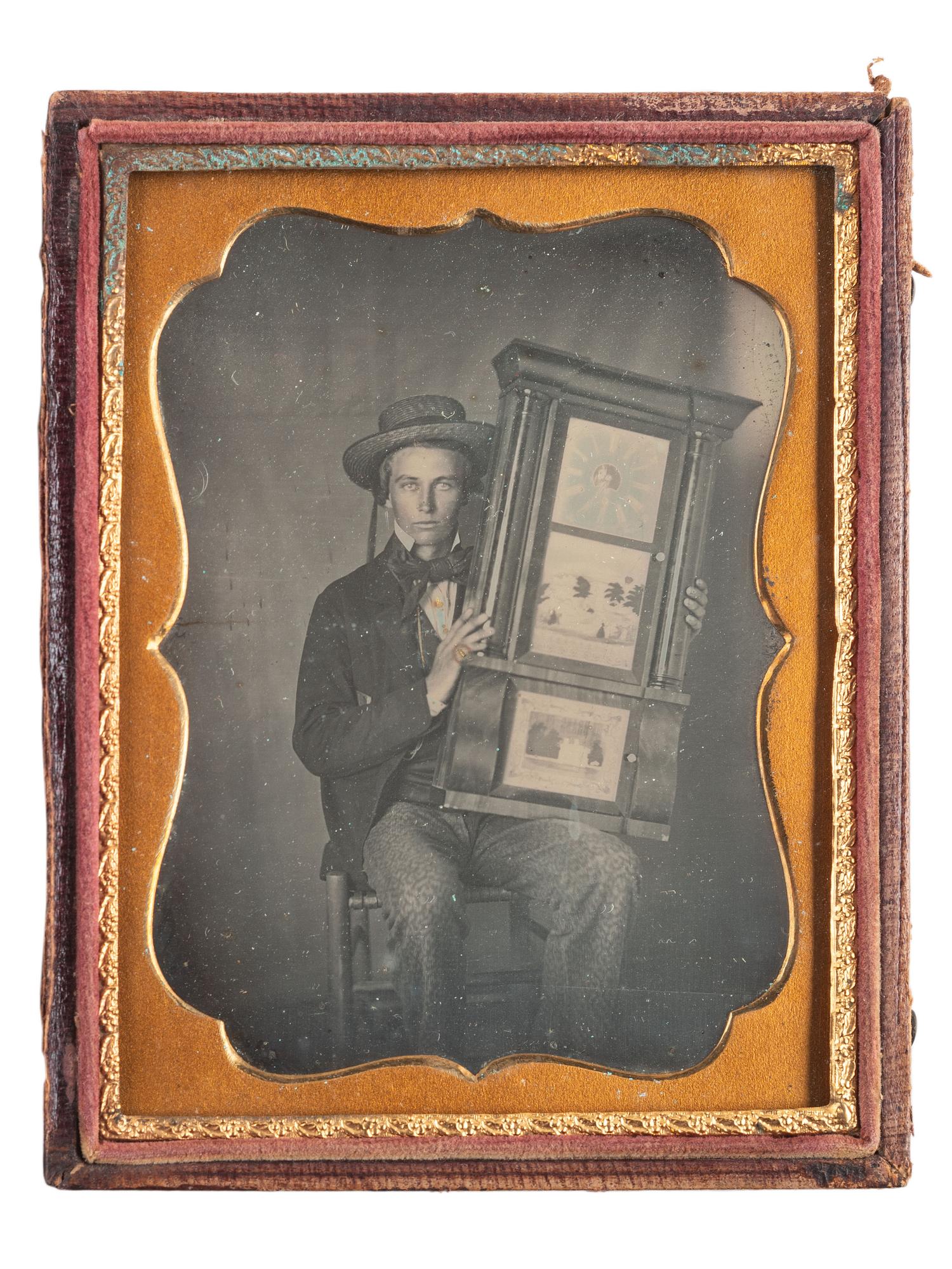 [EARLY PHOTOGRAPHY]. Quarter plate daguerreotype of a young man holding a clock.