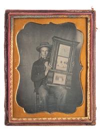 [EARLY PHOTOGRAPHY]. Quarter plate daguerreotype of a young man holding a clock.
