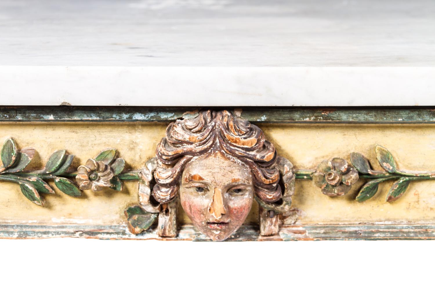 A Continental Cream and Green Painted Center Table Height 33 1/4 x width 54 x depth 25 1/4 inches. — 18TH CENTURY