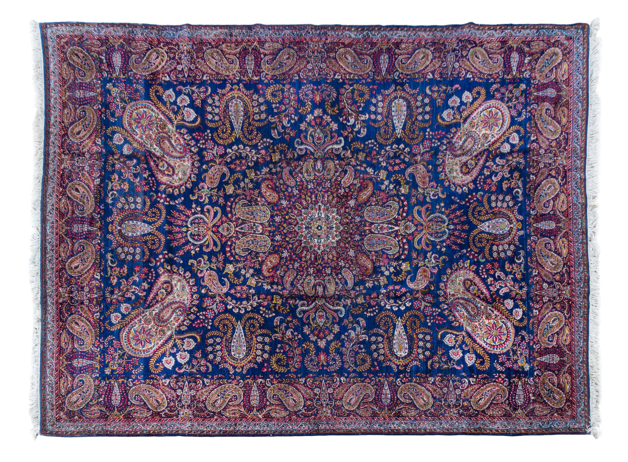 A Kirman Wool Rug 11 feet 8 inches x 8 feet 10 inches.