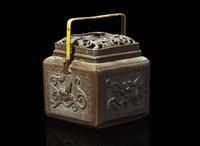 A Japanese patinated bronze hand warmer, Edo to early Meiji period 銅加漆暖爐 江戶至明治初
