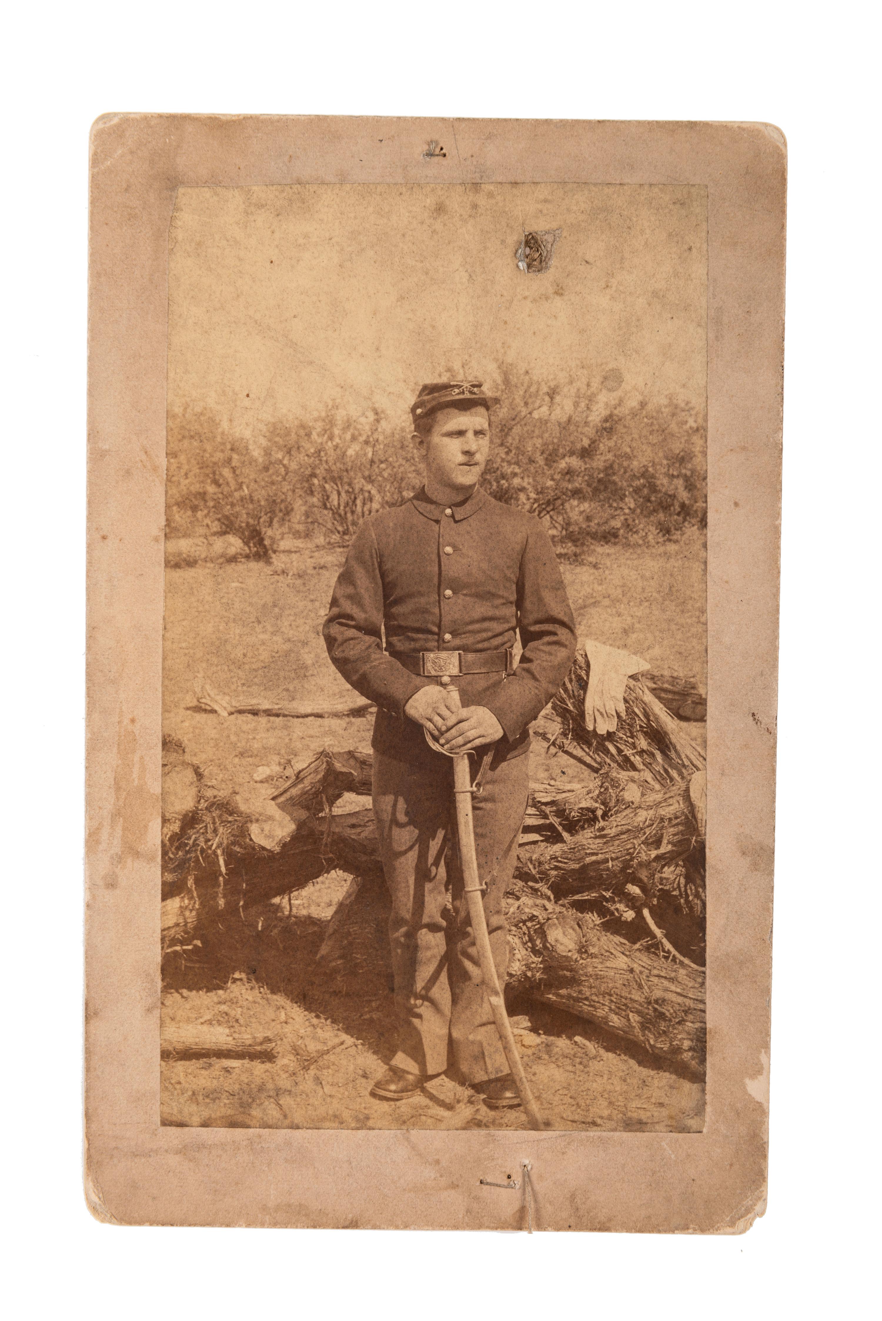 [LATE INDIAN WARS]. A group of 4 photographs, highlighted by outdoor view of armed US Infantry soldier in the desert and portrait of 9th US Infantry soldiers.