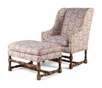 A Louis XIII Style Carved Armchair and Ottoman