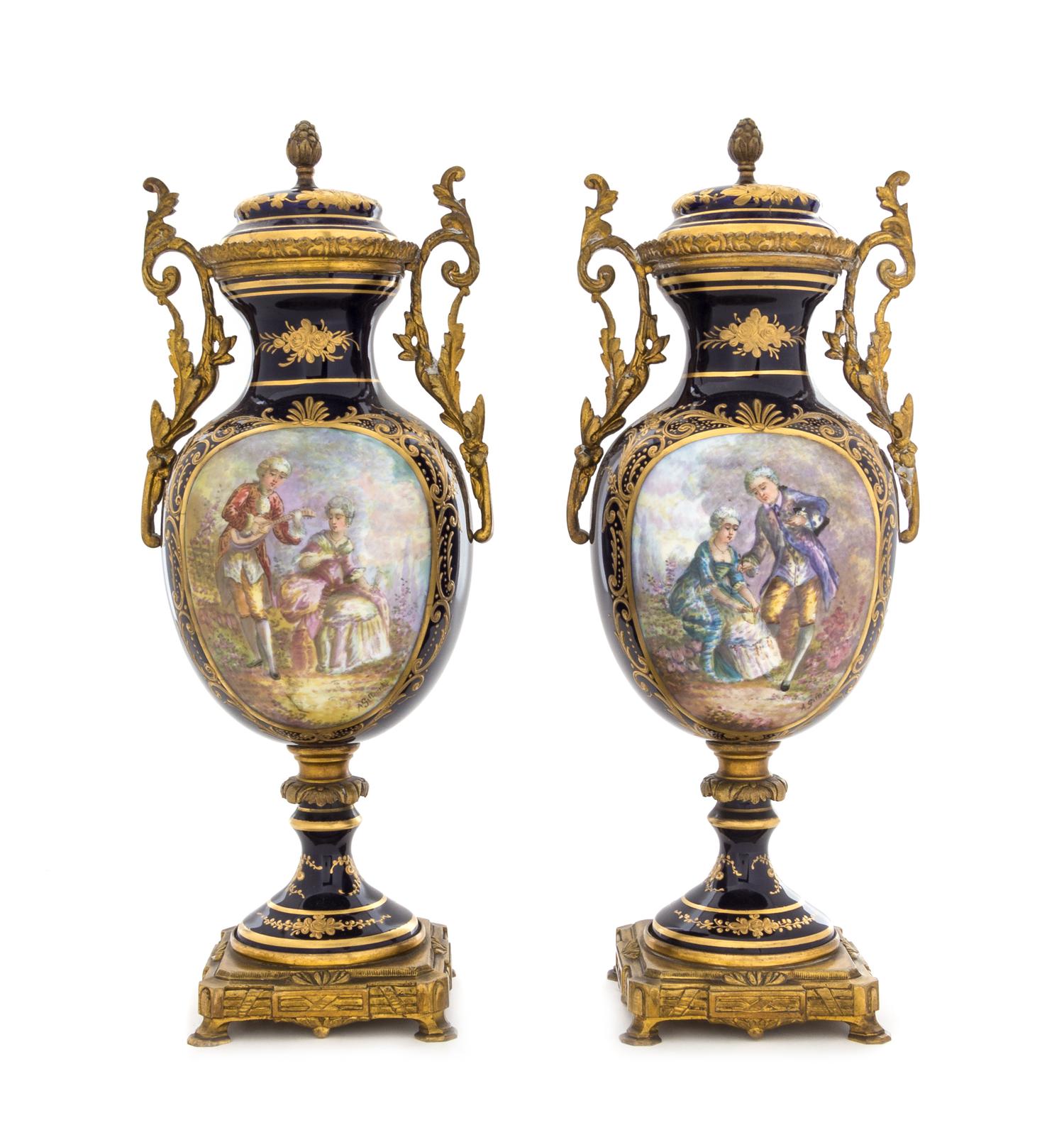 A Pair of Sevres Style Porcelain Urns Height 12 3/4 inches. — 19TH CENTURY
