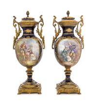 A Pair of Sevres Style Porcelain Urns Height 12 3/4 inches. — 19TH CENTURY