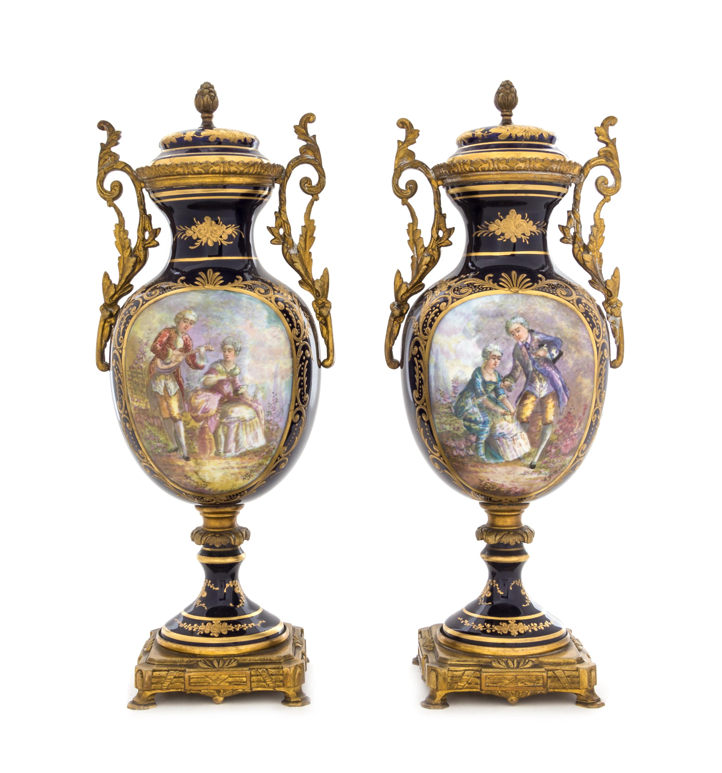 A Pair of Sevres Style Porcelain Urns Height 12 3/4 inches. — 19TH CENTURY