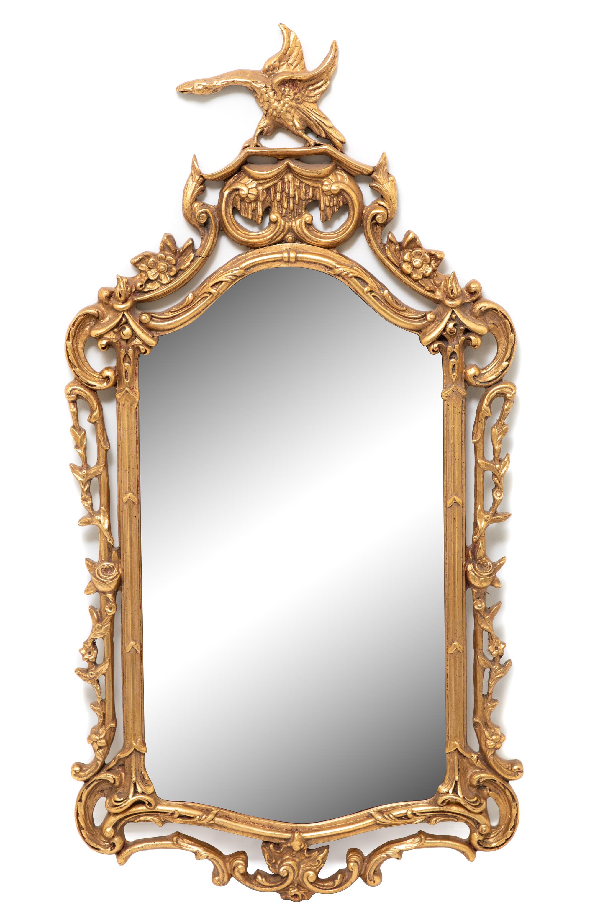 A George II Style Carved Giltwood Mirror Height 52 x width 26 3/4 inches.