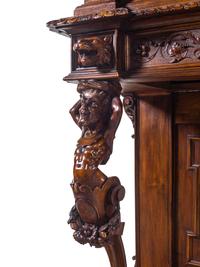 A Renaissance Revival Carved Walnut Cabinet on Stand