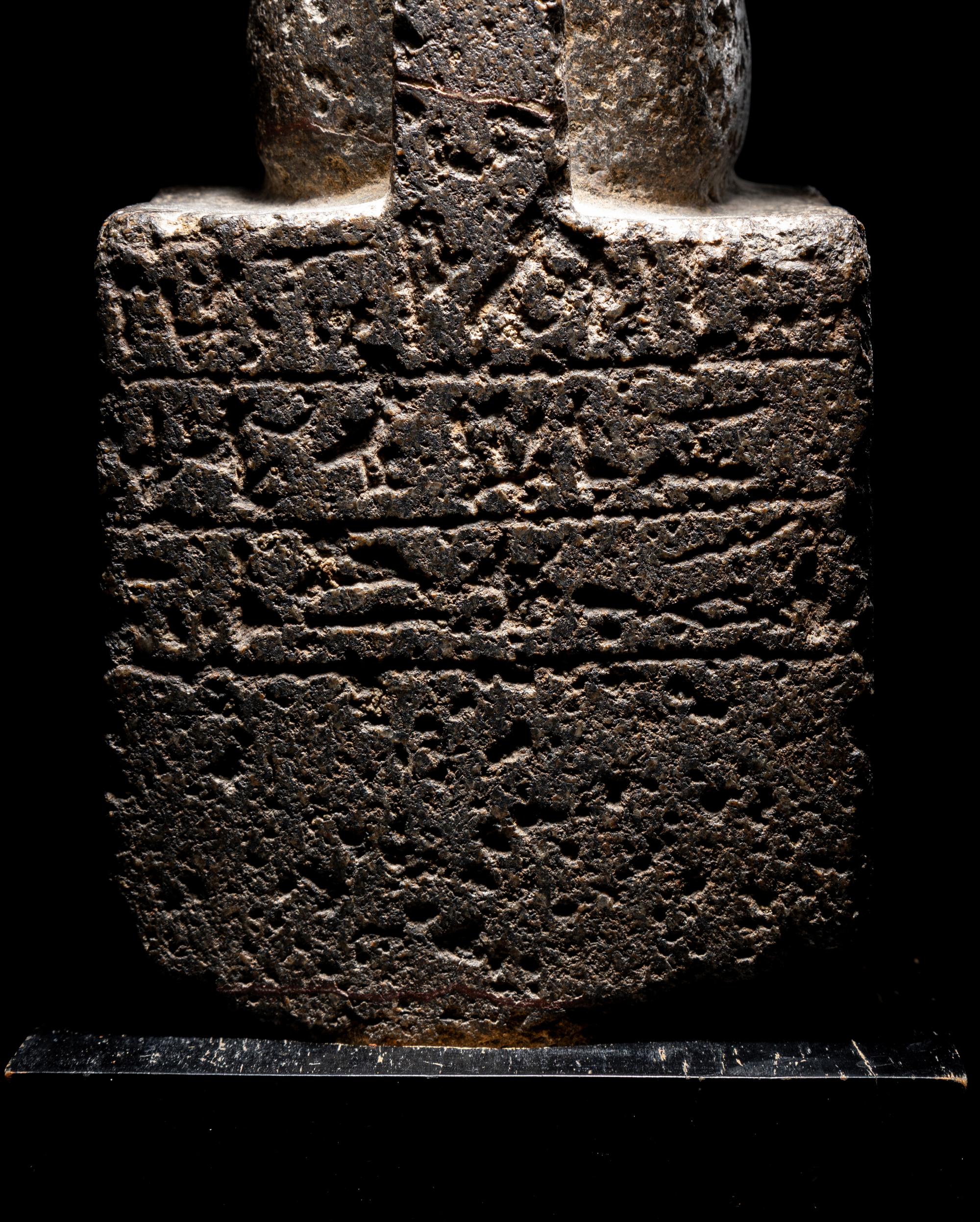 An Egyptian Diorite Seated Figure