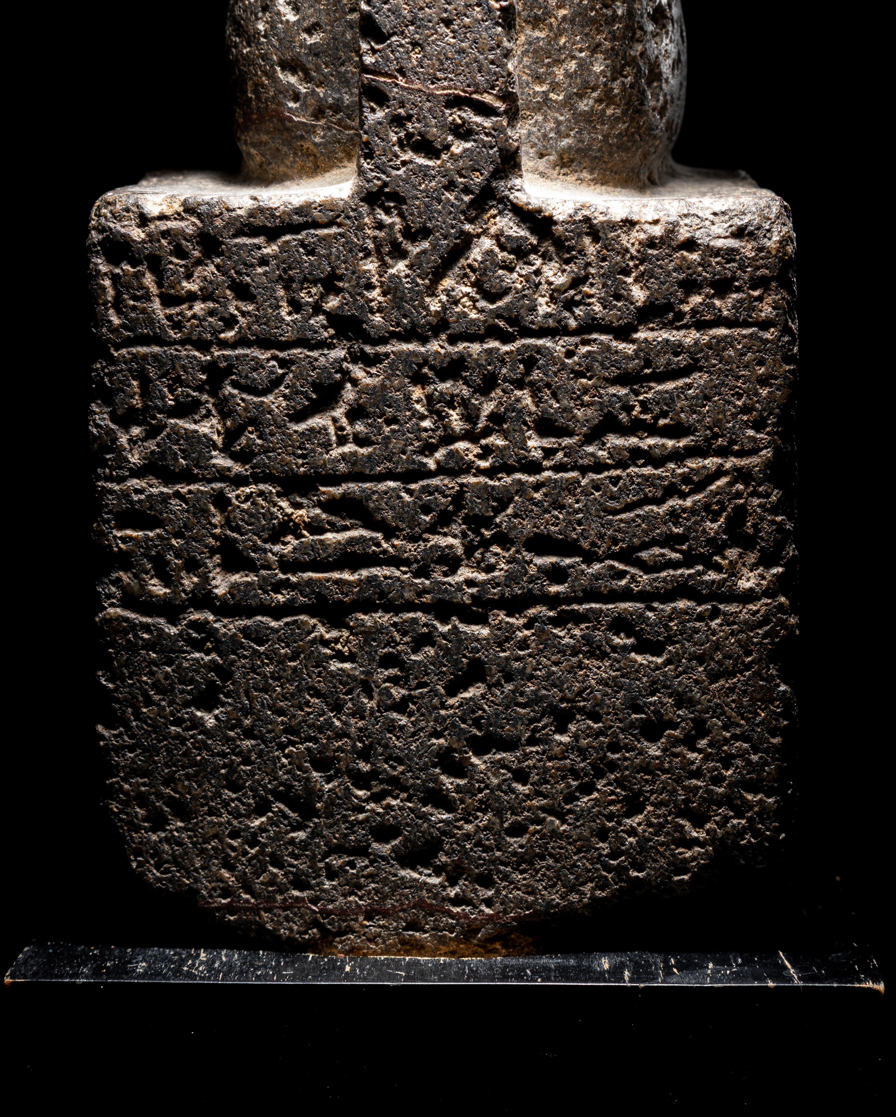 An Egyptian Diorite Seated Figure