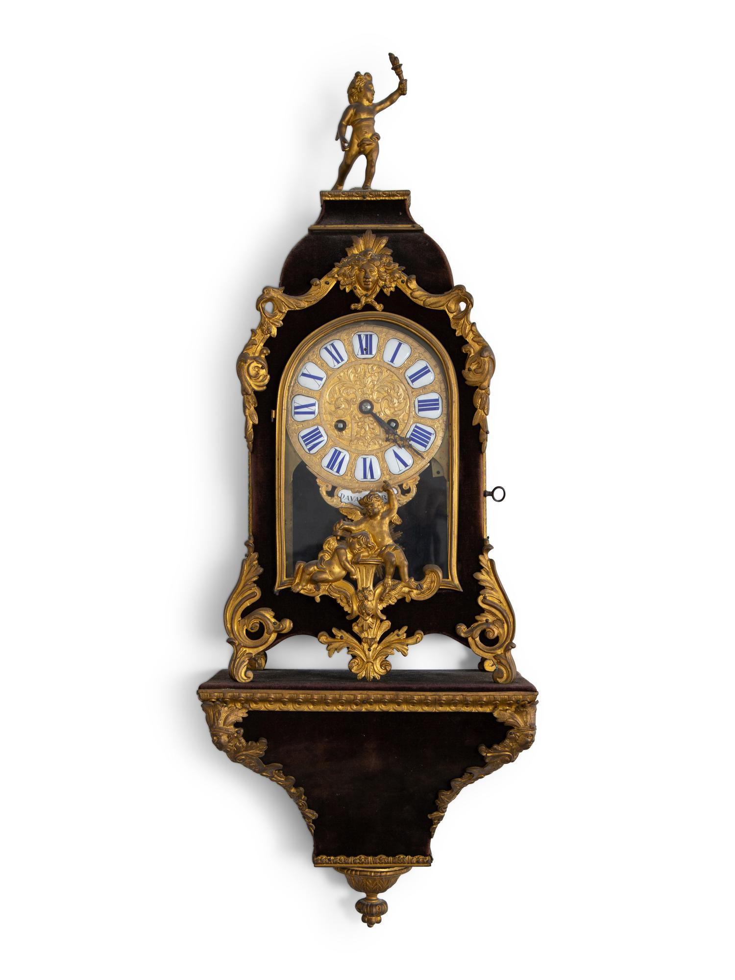 A Louis XV Style Gilt Bronze and Velvet Bracket Clock