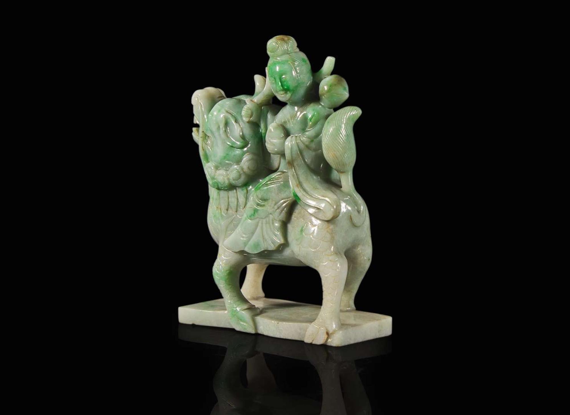 A Chinese jadeite figure of a meiren on a fabulous beast 翡翠雕仙人逸獸