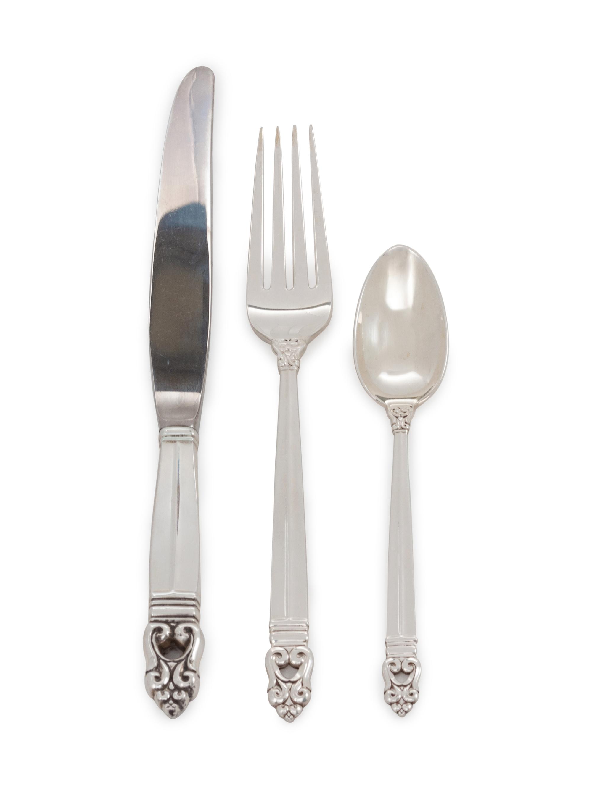 Royal Danish pattern, comprising: 16 dinner knives with stainless steel blades (continental) 7 dinner knives with stainless steel blades (place) 10 luncheon knives with stainless steel blades 6 steak knives with stainless steel blades 18 butter spreaders 16 dinner forks 16 luncheon forks 14 salad forks 12 cocktail forks 2 oyster forks 9 strawberry forks 14 teaspoons 14 soup spoons 8 iced tea spoons 12 grapefruit spoons 12 demitasse spoons 2 salt spoons 1 carving set 7 serving utensils with stainless steel elements 18 serving utensils 215 items total.