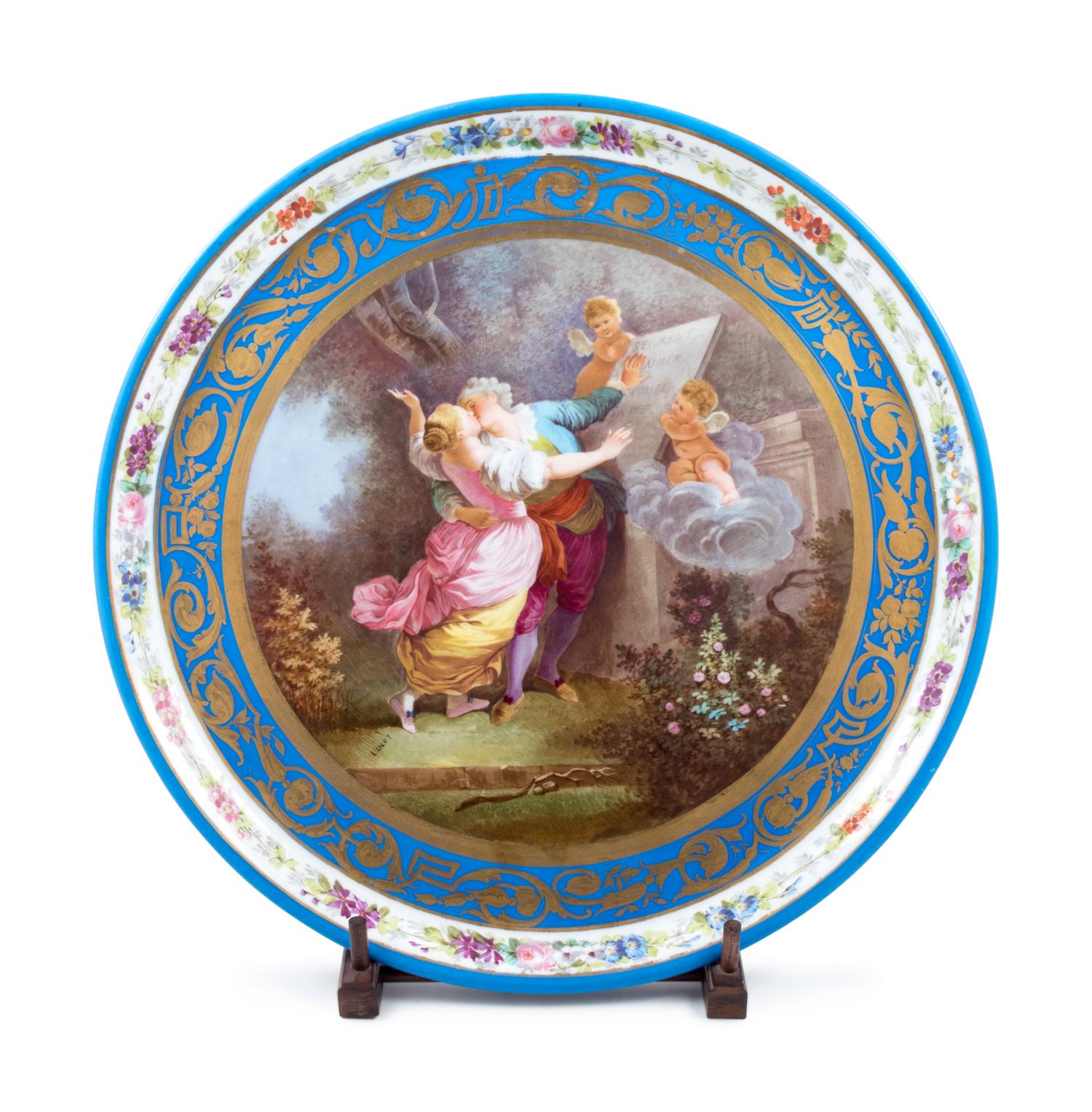 A Sèvres Style Painted and Parcel Gilt Porcelain Charger