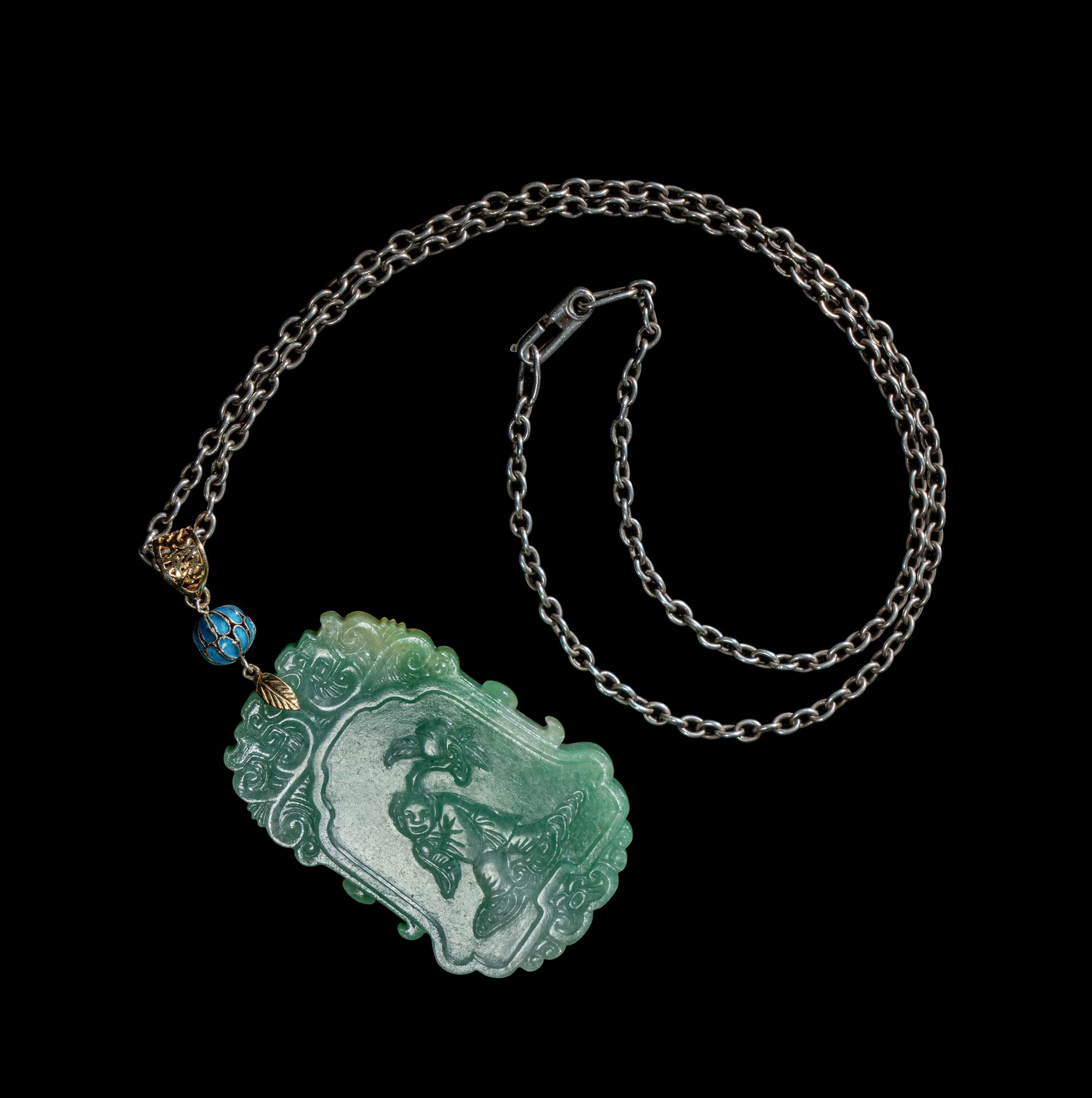 A Fine Chinese Semi-Translucent Green Jadeite Pendant
