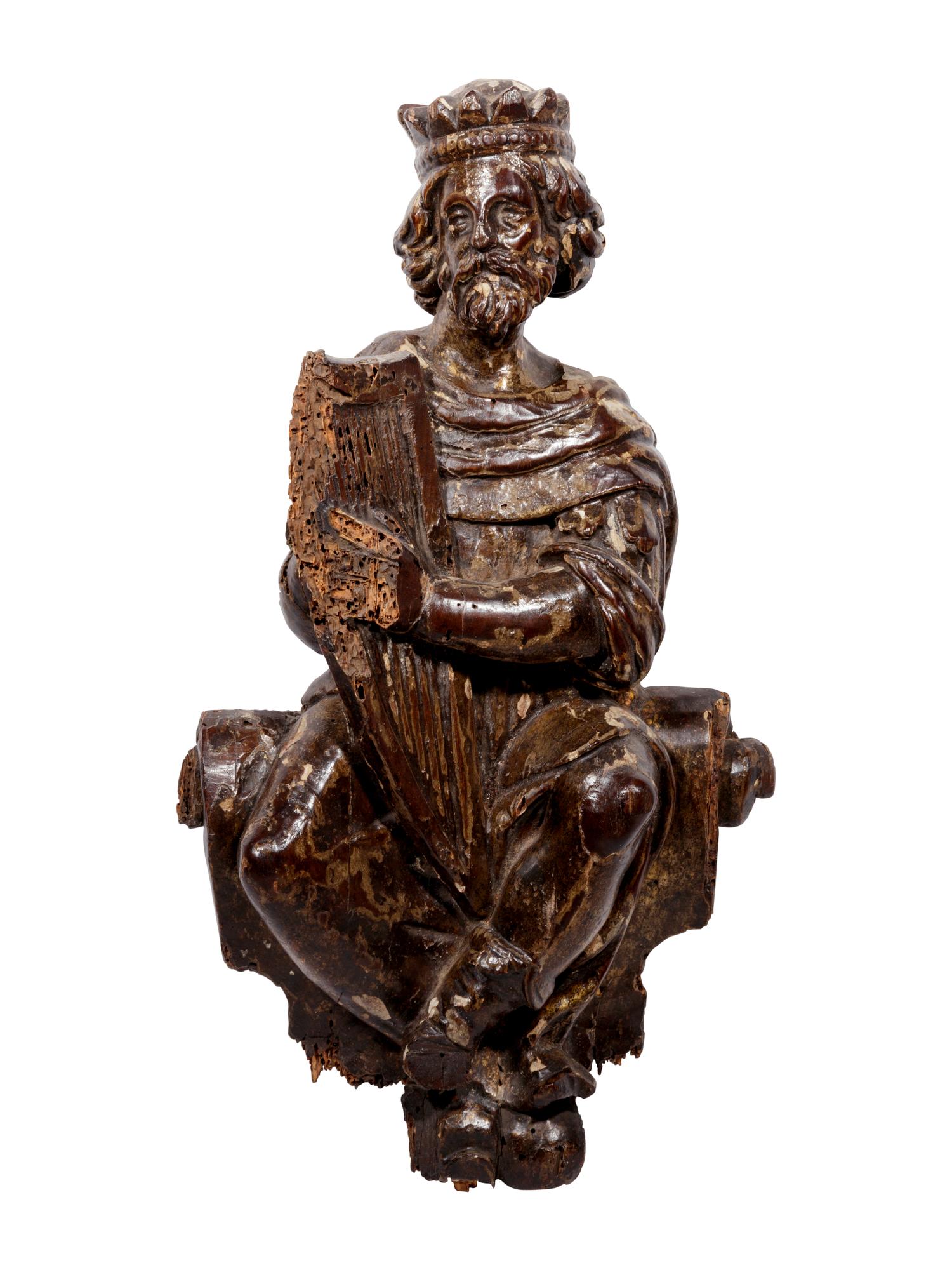 A Continental Carved and Painted Figure of King David Playing the Harp