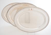 A Collection of Five Silver-plate Trays, , four oval, one rectangular with handles, each with gadrooned edges.