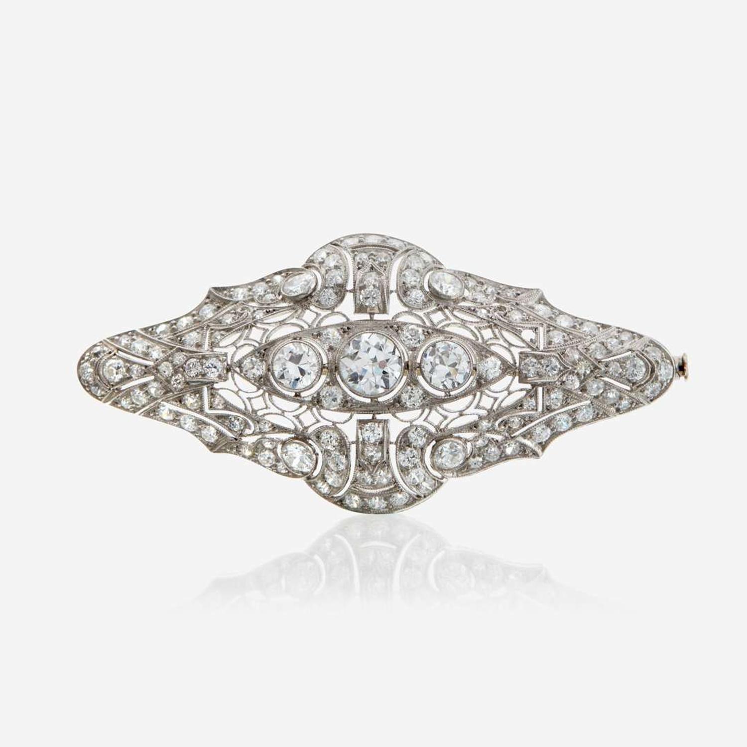 A diamond and platinum brooch