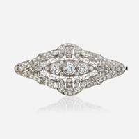 A diamond and platinum brooch