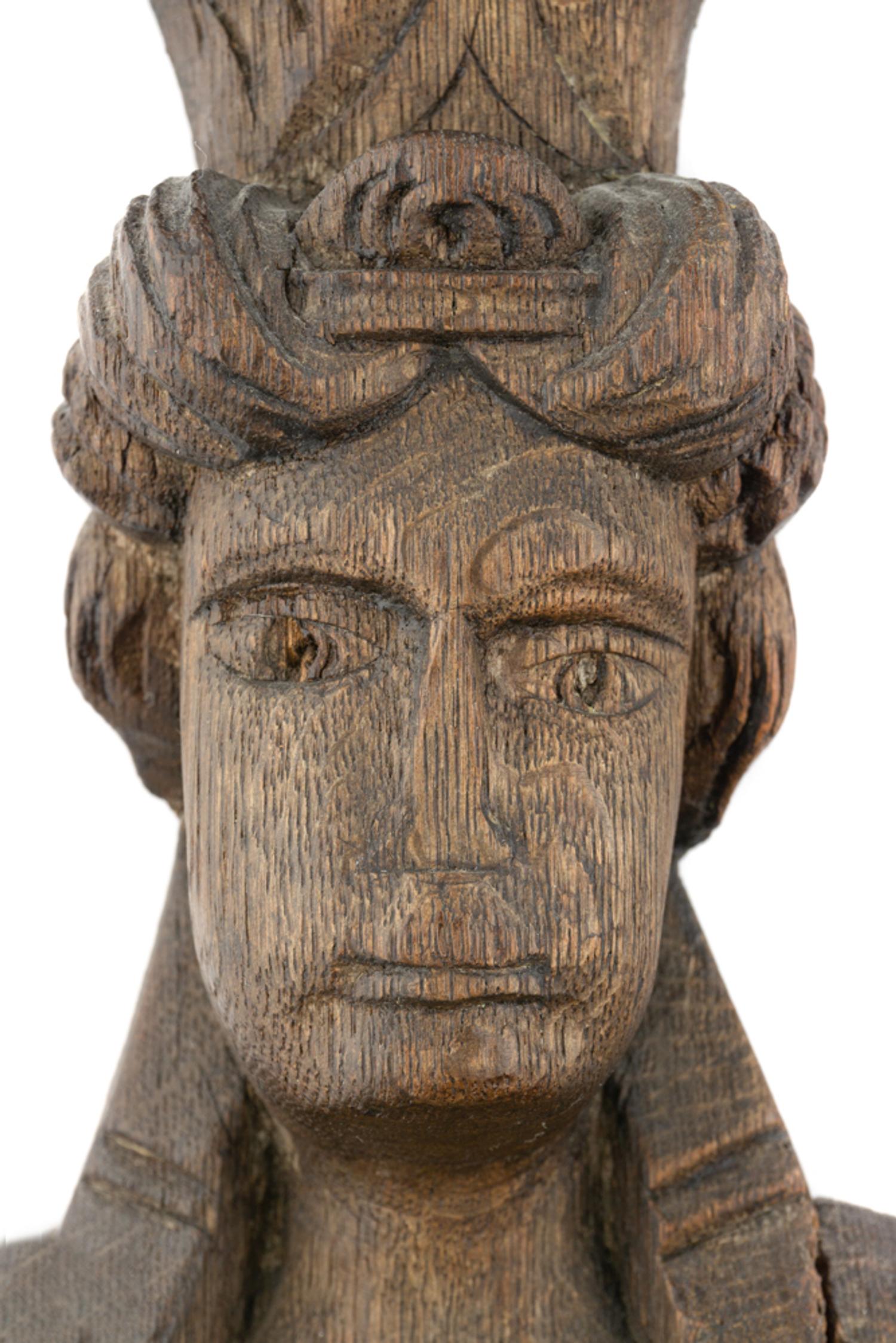 A Group of Three Carved Oak Figural Pilasters