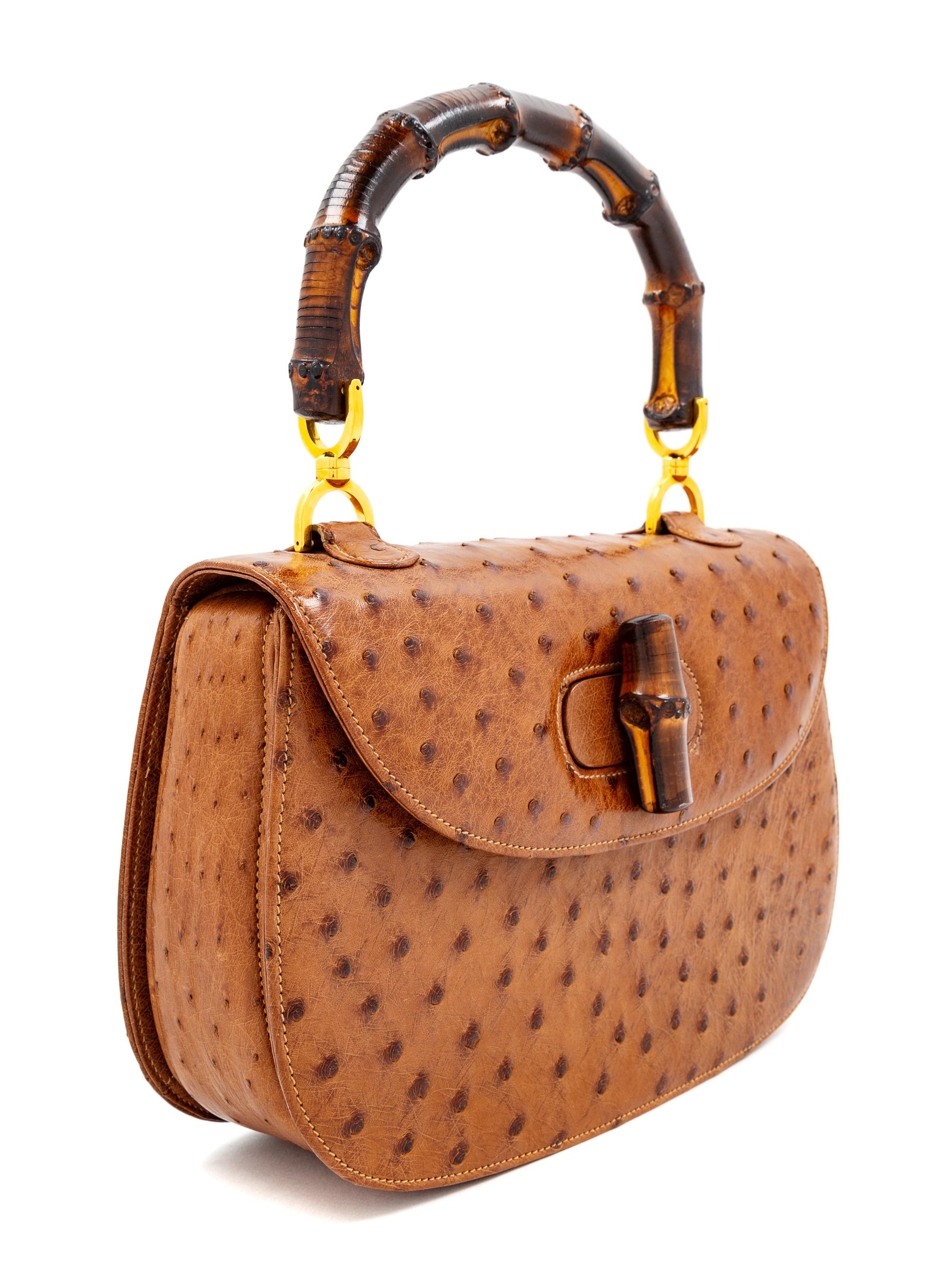 A Gucci Brown Ostrich Bamboo Top Handle Handbag, 7" H x 10.5" W x 2.5" D; Handle drop: 4.5".