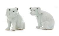 A Pair of Chinese Export White Glazed Porcelain Dogs Height 6 1/4 inches. — LATE 19TH/EARLY 20TH CENTURY