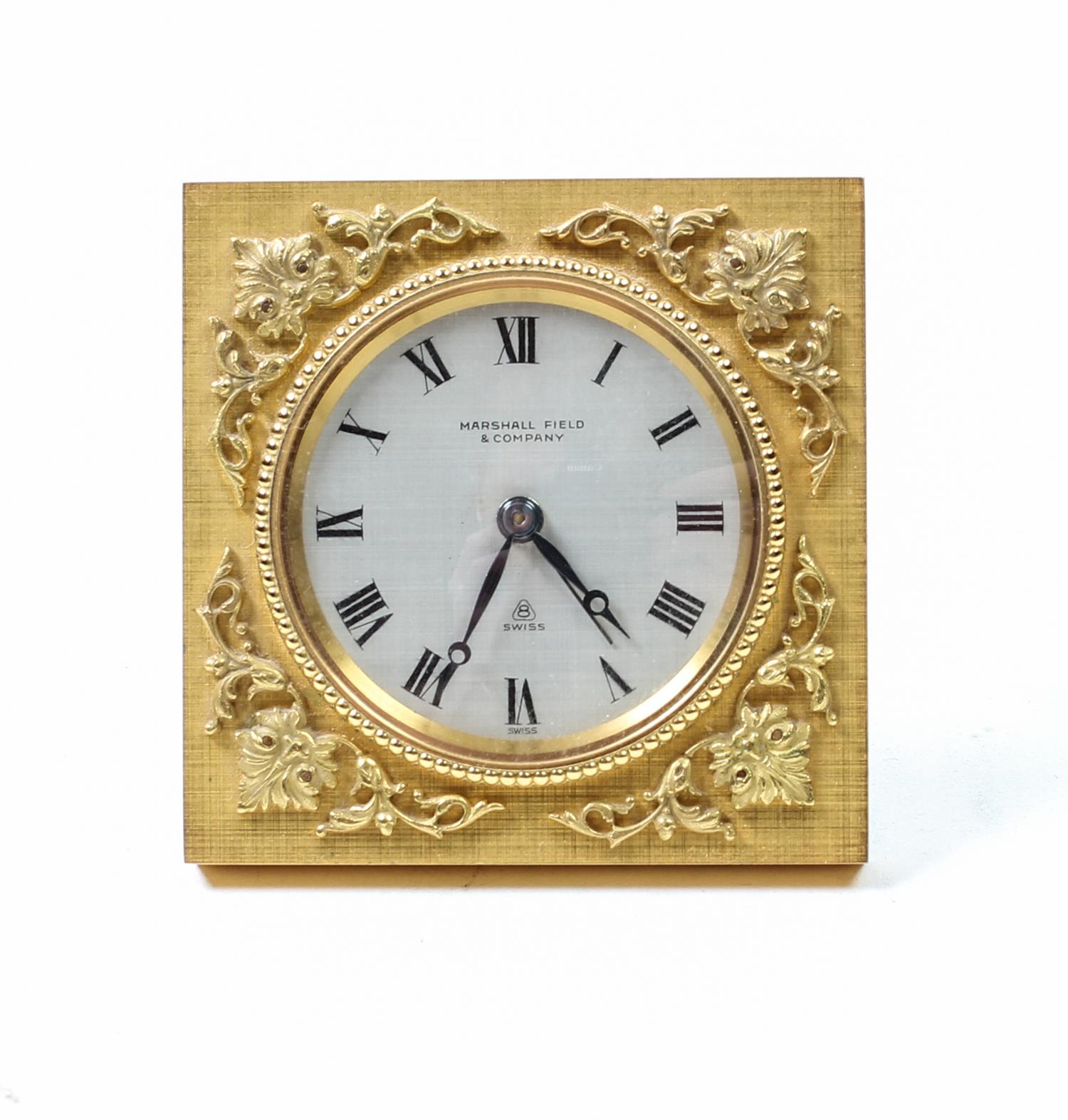A Swiss Gilt Bronze Table Clock Height 2 7/8 inches. — FIRST HALF 20TH CENTURY