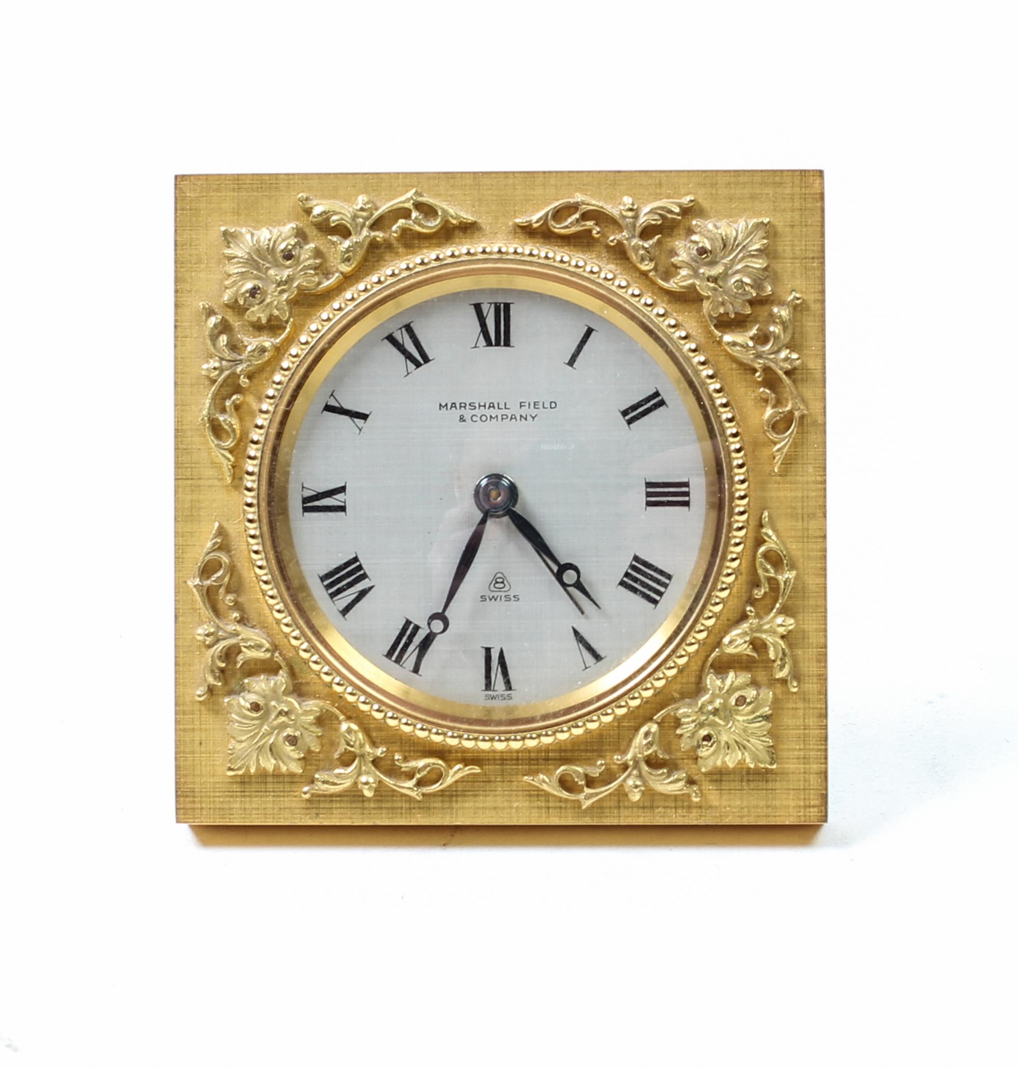 A Swiss Gilt Bronze Table Clock Height 2 7/8 inches. — FIRST HALF 20TH CENTURY