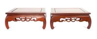 A Pair of Chinese Rosewood Stands Height 4 1/2 x width 11 x depth 11 inches.
