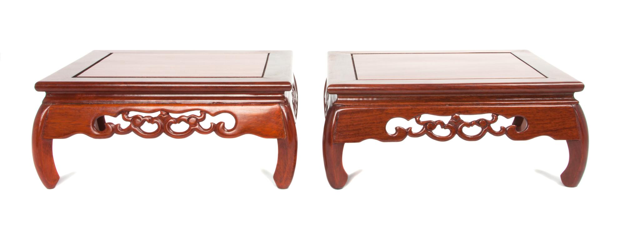 A Pair of Chinese Rosewood Stands Height 4 1/2 x width 11 x depth 11 inches.