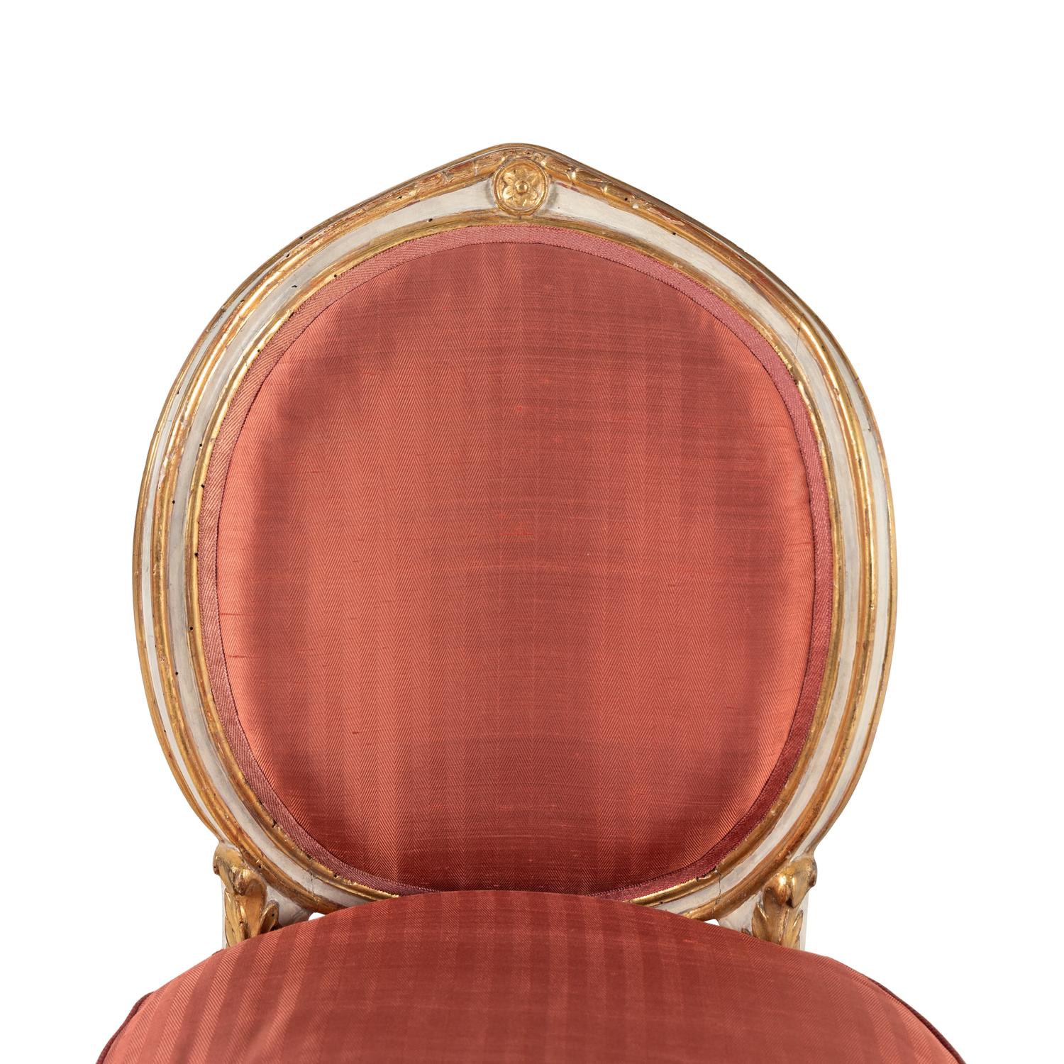 A Set of Four Italian Neoclassical Crème-Painted and Parcel Gilt Side Chairs