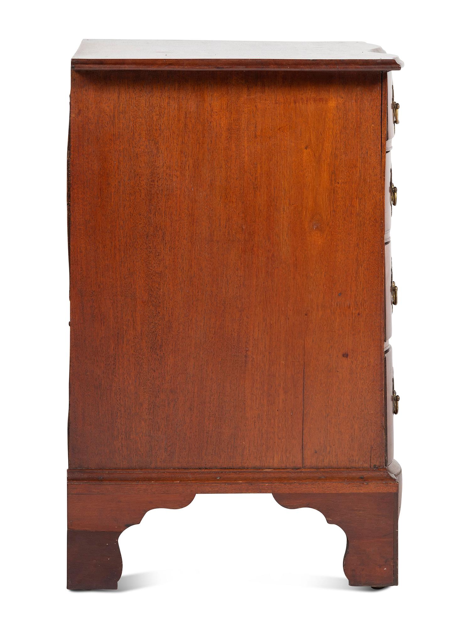 A Chippendale Carved Mahogany Reverse Serpentine Chest of Drawers, 18th Century