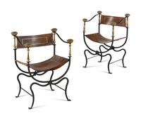 A Near Pair of Continental Iron and Brass Curule Armchairs