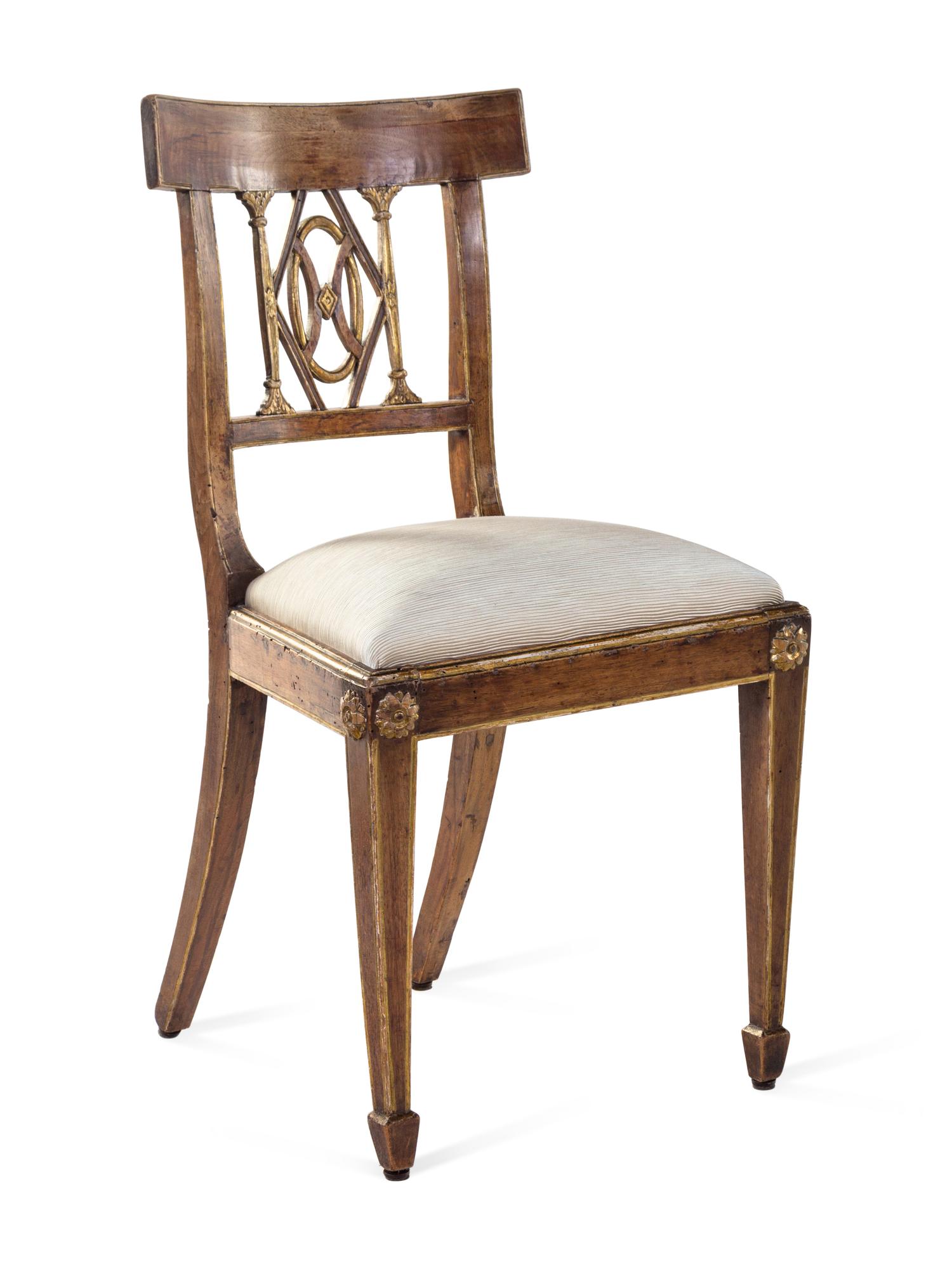 A Set of Four Regency Parcel Gilt Walnut Side Chairs
