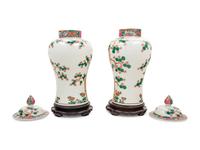 A Pair of Chinese Export Famille Rose Porcelain Covered Jars on Associated Stands