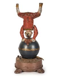 A Spinning Clown on Globe Cast Iron Mechanical Bank