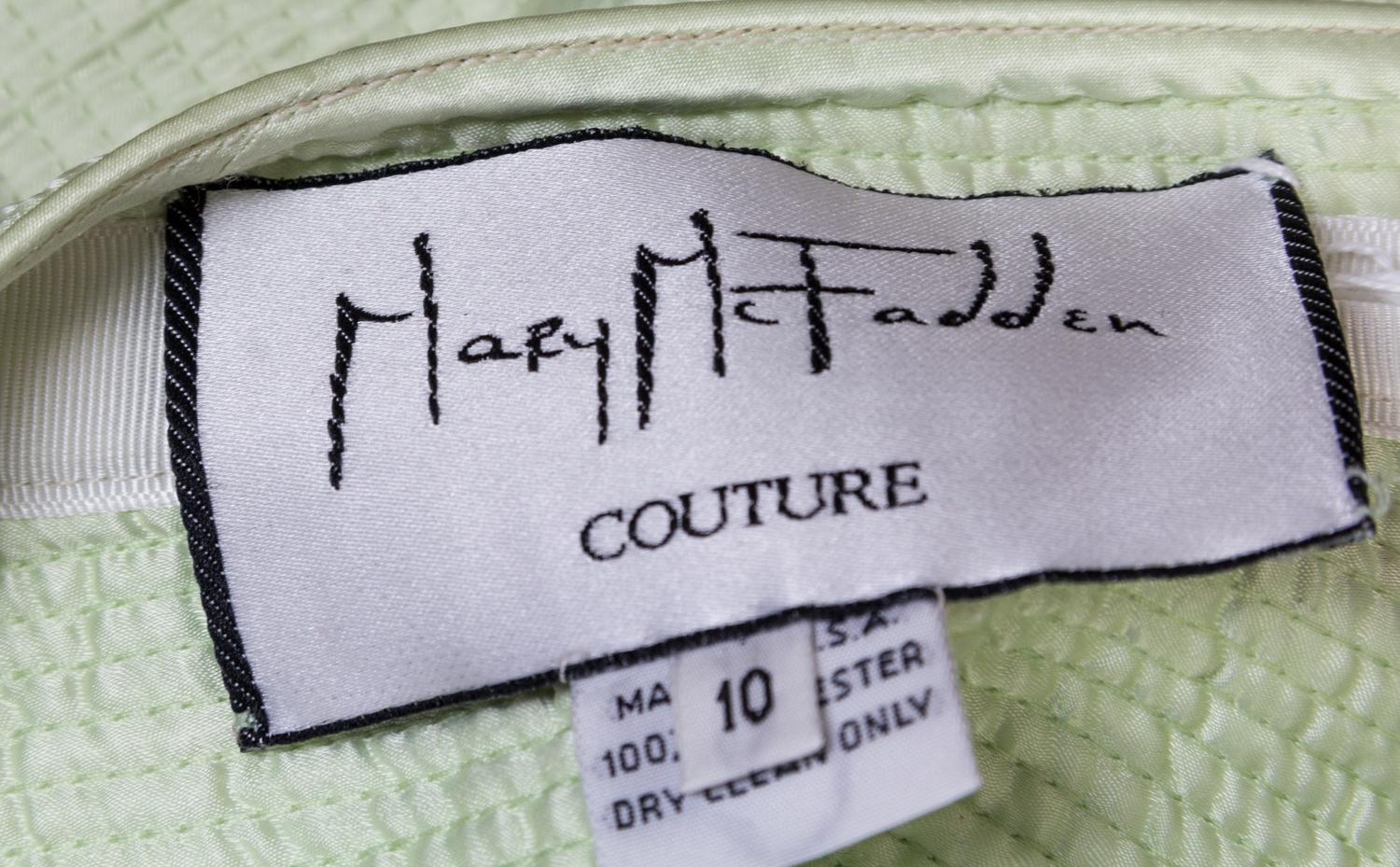A Mary McFadden Light Green Skirt Suit, Size 10.