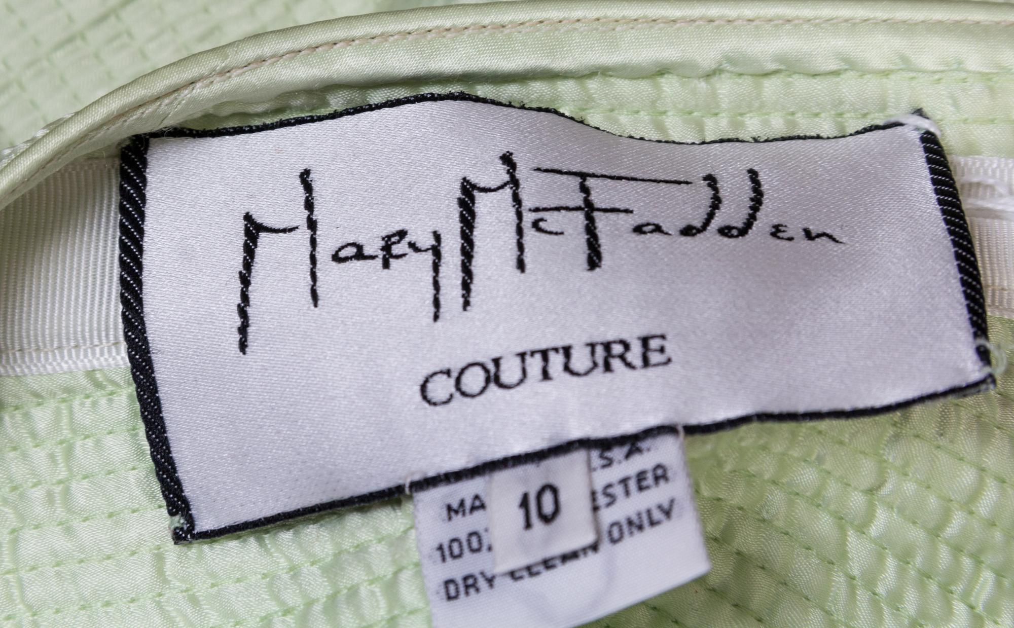 A Mary McFadden Light Green Skirt Suit, Size 10.