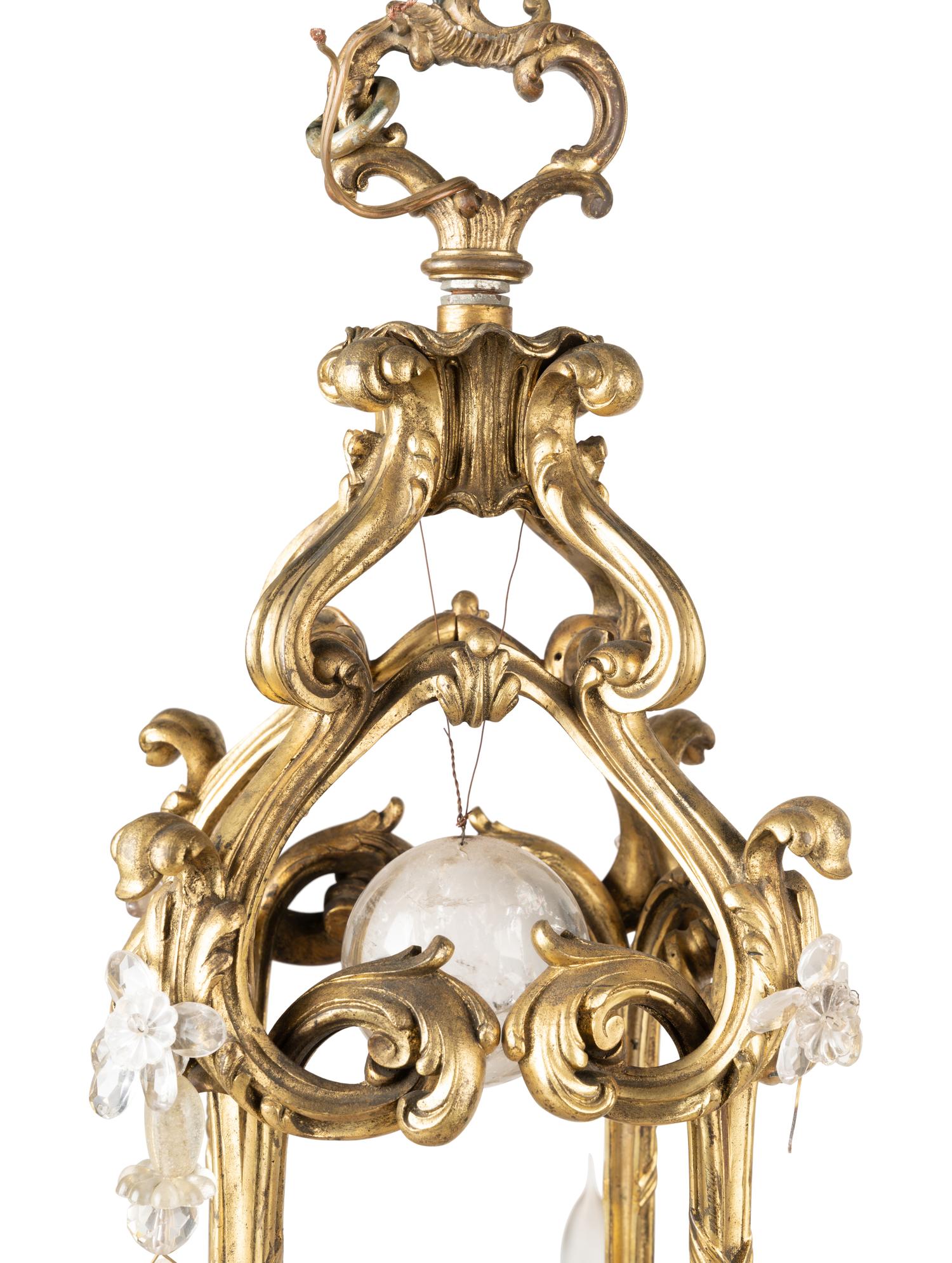 A French Gilt Bronze and Rock Crystal Eight-Light Chandelier