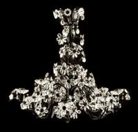 An Italian Iron, Tole and Glass Eight-Light Chandelier Height 31 x diameter 34 inches.