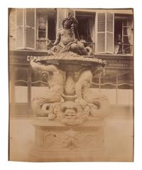 A group of four photographs ( Untitled [man at fountain], circa 1900s; Boutique empire, 14 rue de Grammont , 1903-1904; Hôtel de Neuville, rue Alphonse de Neuville, 1905-1906; Fontaine, faubourg Saint-Martin, 1912)
